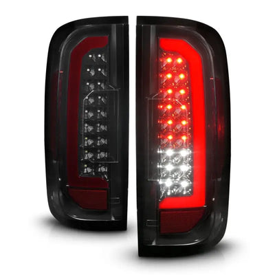 Pair of black LED tail lights for GMC Canyon with red lightbar and smoke lens