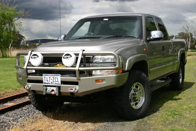 Silver pickup truck with arb combar slvrado99-02 bull bar for tough off-road look