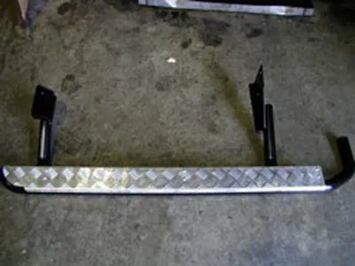 Diamond-plated ARB Deluxe rails rear with black mounting brackets for RV parts & accessories