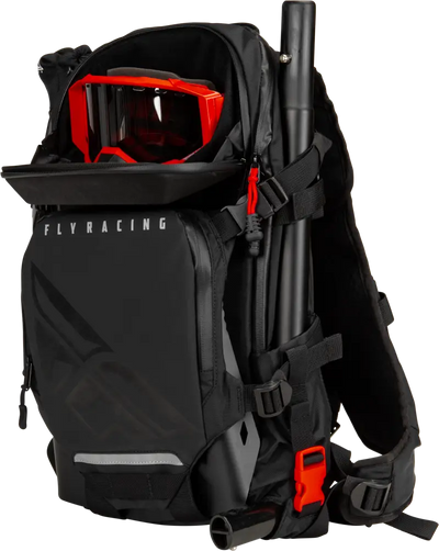 Black Backcountry Pack with shoulder straps, red goggles, and truck parts accessory