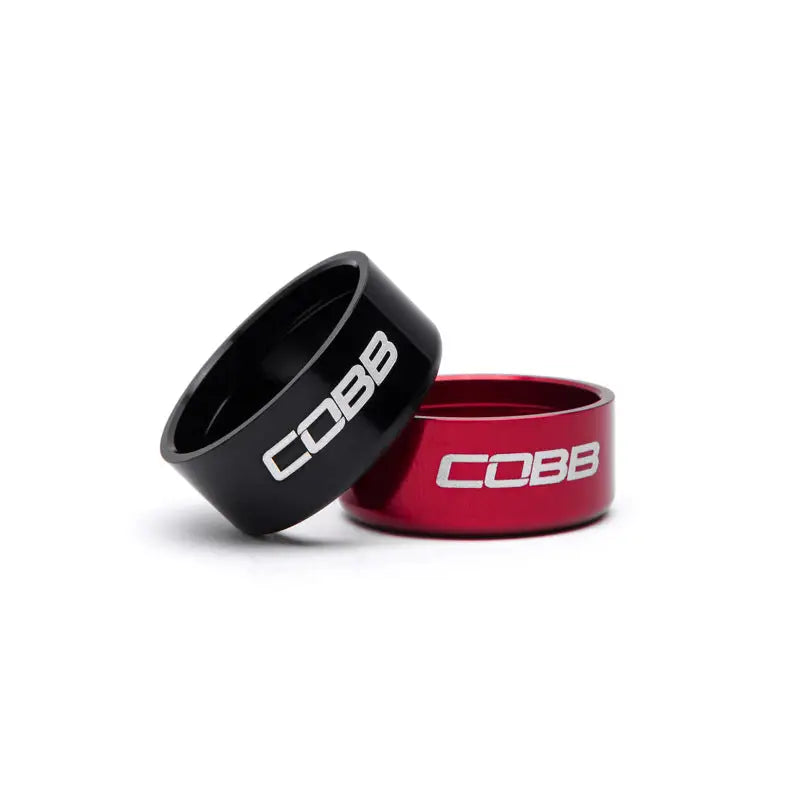 Two metal rings, one black and one red, for the Cobb Subaru 6-Speed Knob