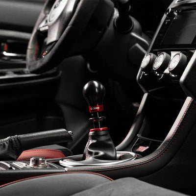 Black and red gear shift knob for Cobb Subaru 6-speed, includes collars