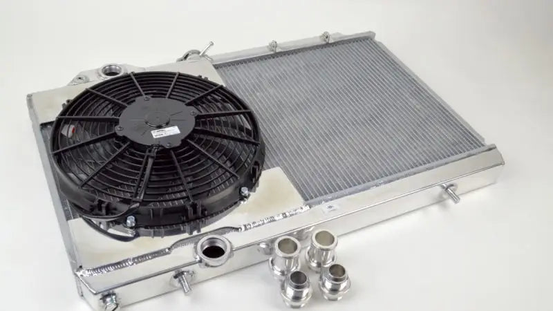 CSF Full Size Slim Radiator with 12in SPAL Fan & Shroud for Mitsubishi Evo 7/8/9 - High-performance cooling, adjustable fittings included.