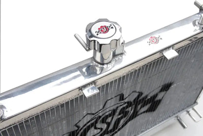 Shiny metal Chevrolet Camaro V8 radiator with cap, perfect for Camaro V8 radiator upgrade