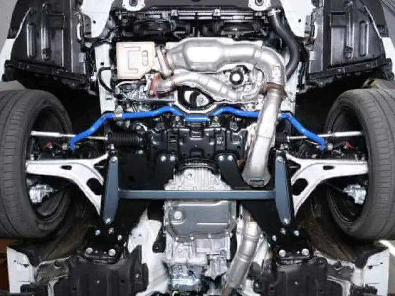 Car chassis showing suspension and exhaust with Cusco sway bar for Subaru WRX