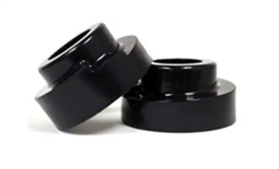 Black cylindrical lift spacers for Ford F-250 4WD leveling kit upgrade