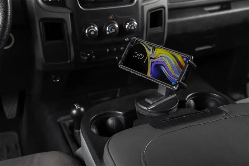 Daystar Universal Hands-Free Phone Grip, black, installed in vehicle cup holder with smartphone, RV, Automotive, Powersports, off-road, marine, exterior, truck accessories, interior, truck bed, rv parts, Truck & Automotive, AVADA - Best Sellers