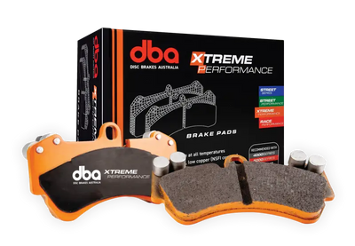 DBA Nissan Patrol Y62 XP Xtreme Performance front brake pads in orange dual-layer design for high temps