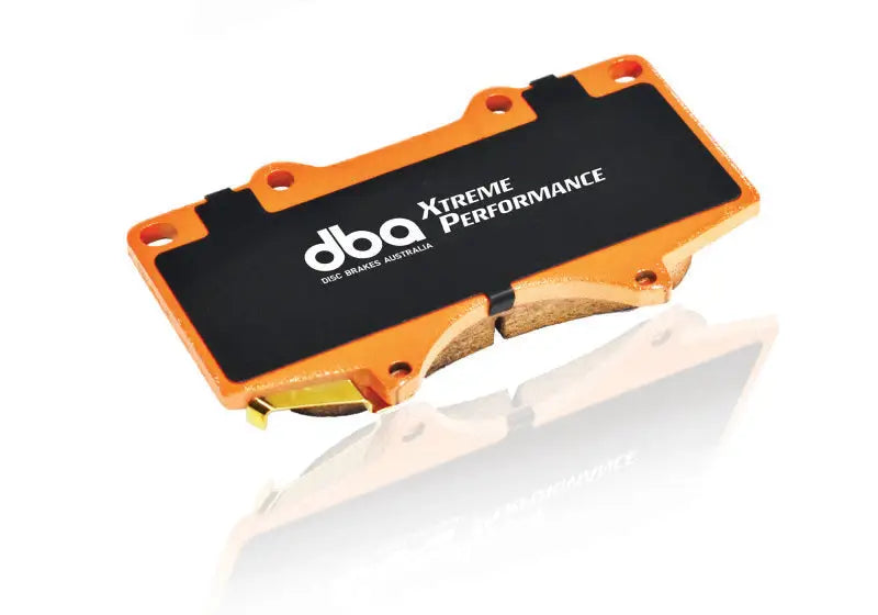 Orange and black DBA Xtreme Performance brake pads for high temperatures