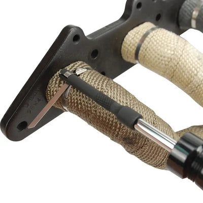 DEI Locking Tie Tool securing a header wrap with stainless steel locking ties.
