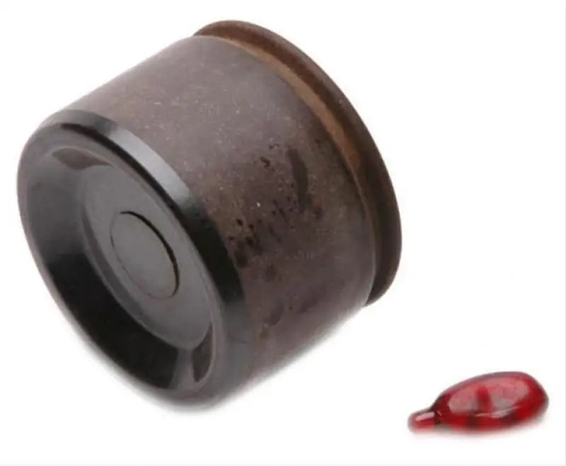 Dark cylindrical worn brake caliper piston for DP85028 Raybestos Hardware Hydraulics