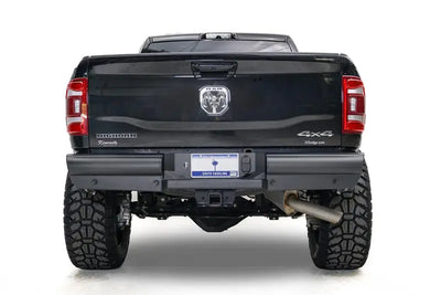 DR19-U4450-1 Fab Fours Black Steel Elite Rear bumper on a black truck, showcasing superior rear-end protection with a rugged, off-road design. Perfect for RV, automotive, powersports, marine, and truck accessories enthusiasts. Bumpers, Grilles & Guards, AVADA - Best Sellers, Must Haves