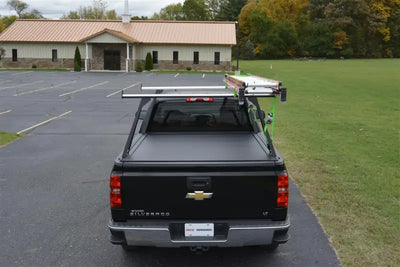 Black pickup truck with bed cover and rack featuring ELD0103 Pace Edwards El400 Series