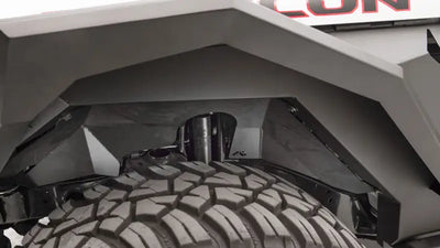 Fab Fours JL1002-1 18 Jp Jl Inner Fender installed on a Jeep Wrangler, showcasing enhanced protection and rugged style.