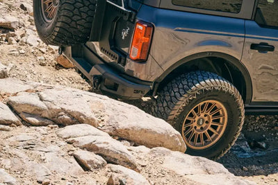 Gray off-road vehicle with fender flares and body armor for Ford Bronco