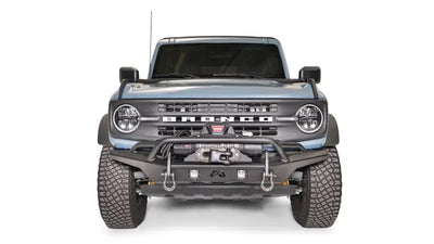 FB21-B5252-1 Fab Fours Stubby Front Bumper on a front view of a blue off-road vehicle