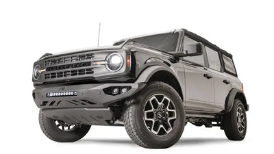 FB21-D5251-1 Fab Fours Vengeance Front Bumper installed on a rugged off-road vehicle, showcasing its aggressive, durable design for tough off-road conditions.