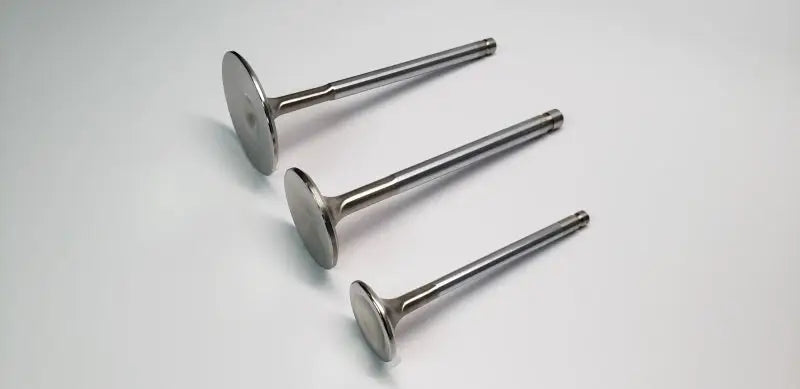 Shiny metal hollow stem intake valves for Chevrolet LS7 by Ferrea in a set of 8