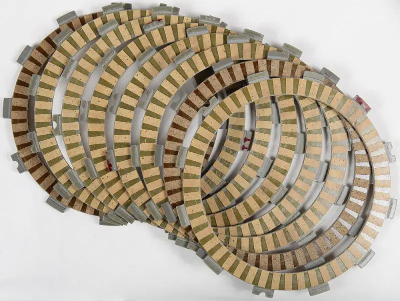 Stack of new tan and gray friction plates for multi-plate clutch FP196-9-001 with high production tolerances