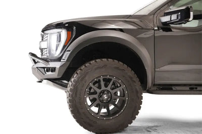 "Front side view of a vehicle fitted with the FR21-D5352-1 Fab Fours Vengeance Front bumper, showcasing its rugged design and superior protection capabilities."