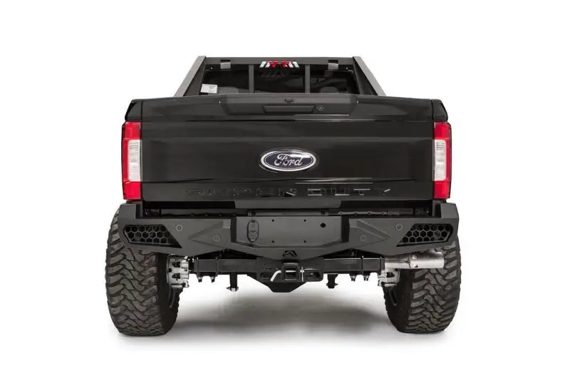 Rear view of a black Ford F250 equipped with FS17-E4151-1 Fab Fours 17 Ven Sen R, showcasing its rugged design and enhanced protection features.