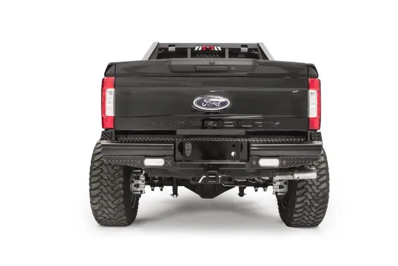 FS17-T4150-1 Fab Fours rear bumper on a Ford F250/F350, showcasing rugged construction and sleek design for superior protection and style.