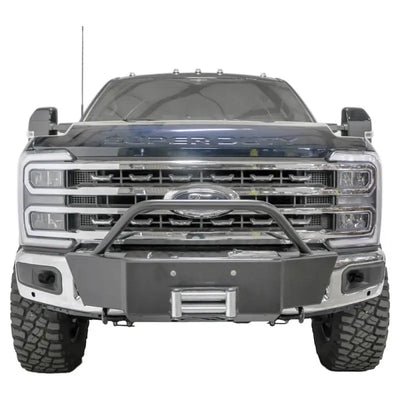Front view of a vehicle equipped with the FS23-N5960-1 Fab Fours Winch Mount, showcasing its robust and secure off-road mounting solution.