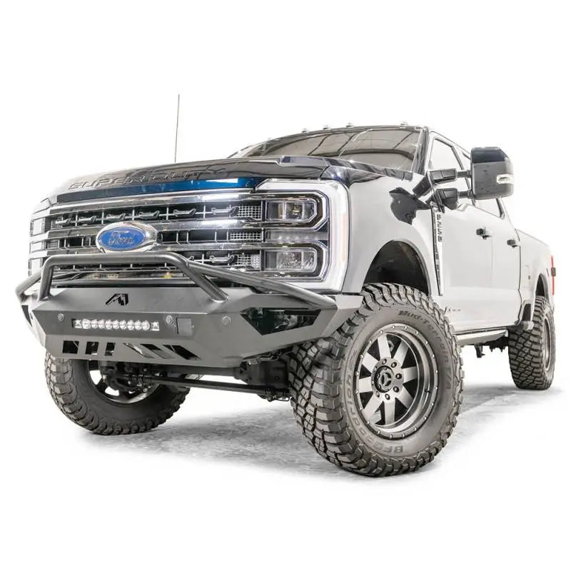 FS23-V5952-1 Fab Fours Vengeance Front bumper on a rugged white truck with aggressive styling and durable construction.