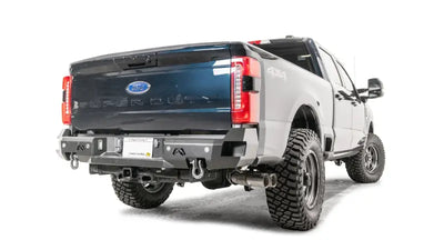 Product image of FS23-W5951-1 Fab Fours 2023 Ford Super Duty Premium Rear Bumper, showcasing its rugged design and enhanced protection on a 2023 Ford Super Duty.