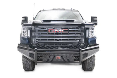 Front view of a GMC truck outfitted with the rugged GM20-S5061-1 Fab Fours Black Steel Front bumper, showcasing enhanced protection and a robust aesthetic.