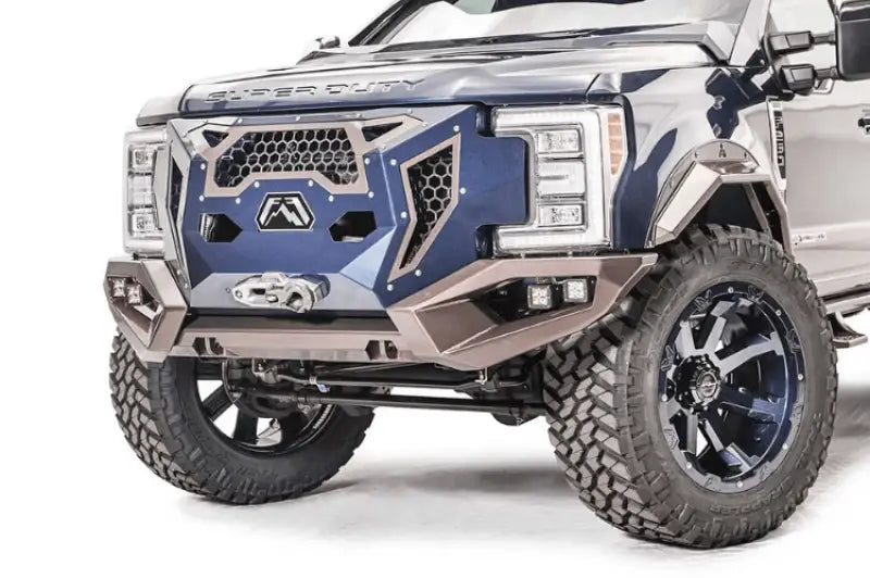 GR4100-1 Fab Fours 17+ Ford Sd Grumper installed on a 2017+ Ford Super Duty, showcasing a unique front bumper and grille combination designed for enhanced aesthetics and robust front-end protection.