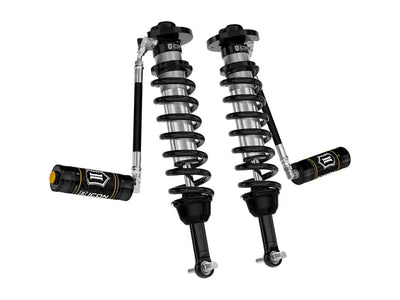 Black and silver coilover shocks with remote reservoirs for Ford F150 4WD 3in lift kit