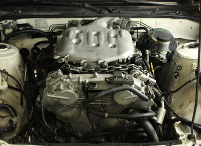 Car engine with chain showing ISR Performance VQ35DE Swap Mount for Nissan 240sx