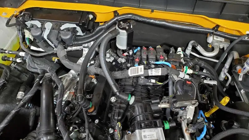 Automobile engine compartment with J&L Ford Bronco 2021-2022 oil separator on passenger side