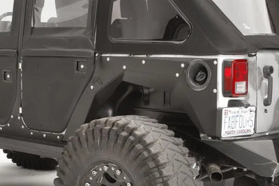 JK1001-1 Fab Fours 07-16 Jp Jk Rear Fender on a Jeep Wrangler JK with rugged tires, showcasing high-quality construction and sleek design for enhanced vehicle protection and style.