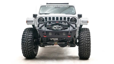 Front view of a white off-road Jeep equipped with JL18-B4752-1 Fab Fours JL/JT Stubby with Pre-Runner Guard for ultimate protection and styling. Sturdy construction for extreme off-road conditions, truck accessories, Bumpers, Grilles & Guards, AVADA - Best Sellers, Must Haves
