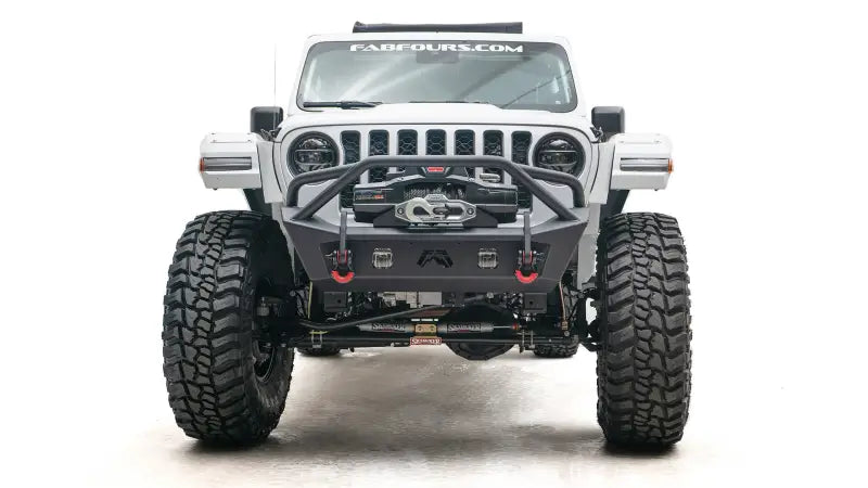 Front view of a white off-road Jeep equipped with JL18-B4752-1 Fab Fours JL/JT Stubby with Pre-Runner Guard for ultimate protection and styling. Sturdy construction for extreme off-road conditions, truck accessories, Bumpers, Grilles & Guards, AVADA - Best Sellers, Must Haves