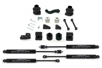 Fabtech K4037M Lift Kit Suspension components laid out, featuring shocks, spacers, and mounting hardware for enhanced vehicle performance.