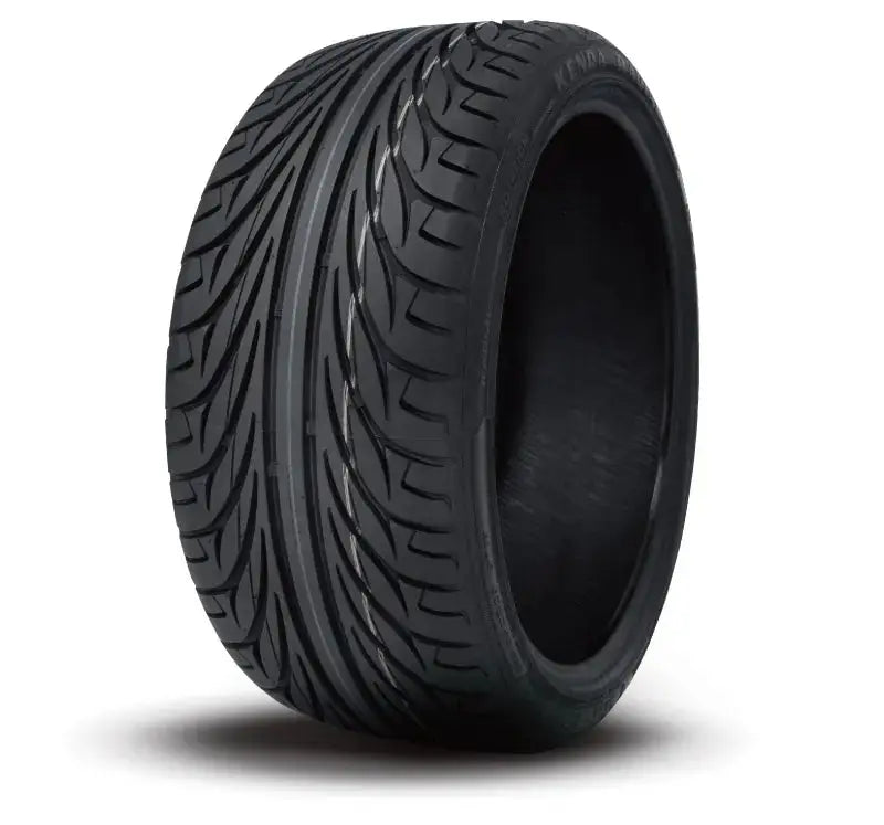 Black new high-performance Kenda KR20 Kanine rear tire with distinct directional tread pattern
