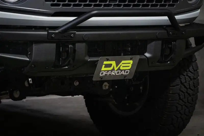 License Plate Relocation Kit Relocates Below The Center At An Angle On Front Bumper; Powder Coated; Black; Steel