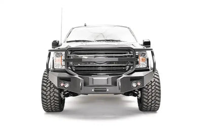 Black truck with heavy-duty grill guard from M3852-1 Fab Fours Ford Rap Adapt Rel Bracket