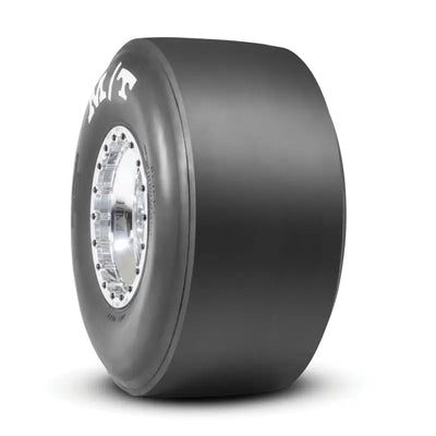 Mickey Thompson ET drag tire with black tread and silver hubcap