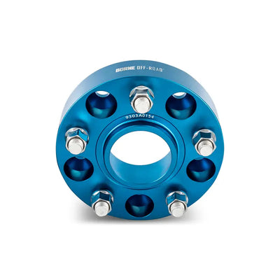 Blue Mishimoto Borne off-road wheel spacers with bolts for improved fitment