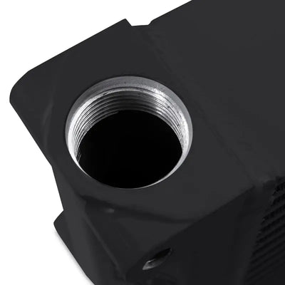 Black metal threaded port on Mishimoto Heavy-Duty Oil Cooler for added durability