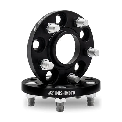 Black Mishimoto wheel spacers with studs for better fitment and style