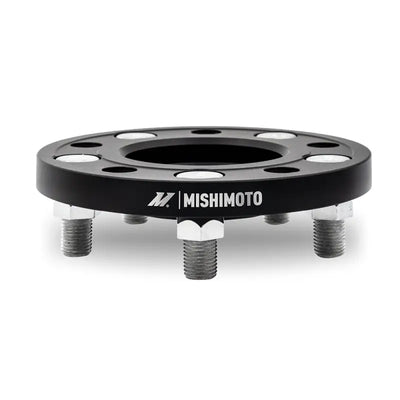 Black Mishimoto Wheel Spacers with studs for improved fitment and style