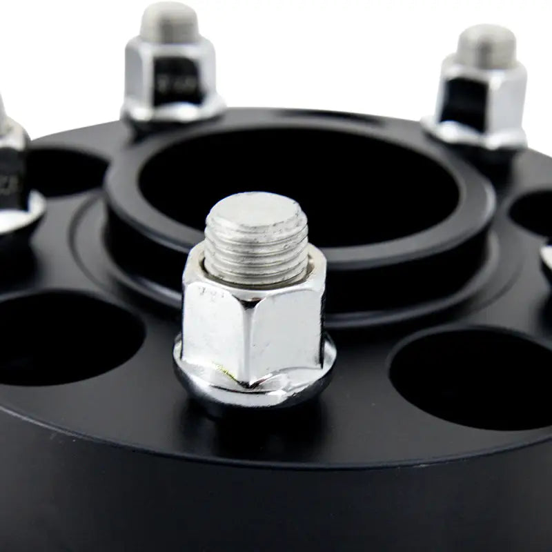 Black mishimoto wheel spacers with lug nuts for 5x114.3 wheels