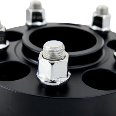 Black Mishimoto wheel spacers with lug nuts for 5x120 wheels and M14 threads