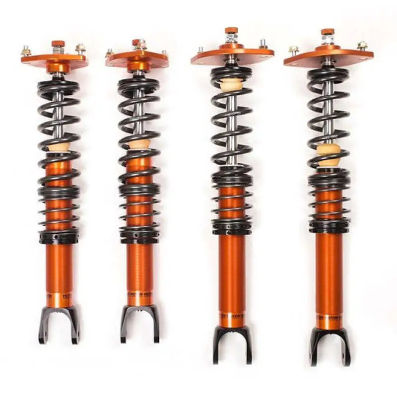 Four orange and black Moton 1-Way Series Coilovers for BMW M3 G80 and M4 G82