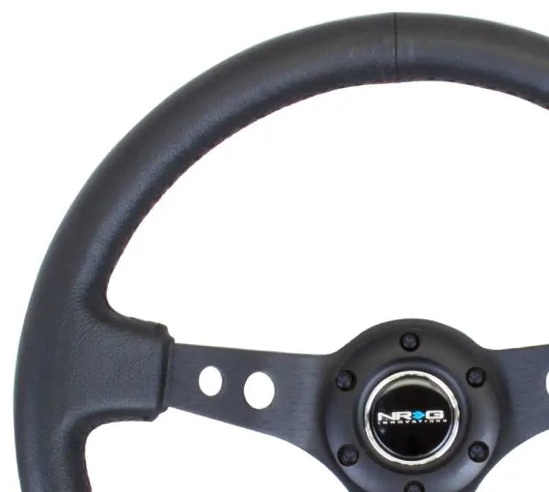 NRG Reinforced Steering Wheel (350mm / 3in. Deep) Blk Leather w/Blk Spoke & Circle Cutouts 